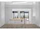 Modern kitchen island featuring a butcher block top and sliding glass doors beyond at 2930 Candela Ct, Apopka, FL 32703