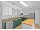 Bright kitchen featuring stone counters, stainless appliances, and a center island at 2930 Candela Ct, Apopka, FL 32703