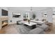 Stylishly furnished living room with fireplace, large sofa, and elegant decor at 2930 Candela Ct, Apopka, FL 32703