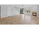 Open-concept living room with tile flooring, fireplace, and access to the entryway at 2930 Candela Ct, Apopka, FL 32703