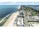 Breathtaking aerial view showcasing community pools, parking, a sandy beach, and the vast ocean at 3023 S Atlantic Ave # 2050, Daytona Beach, FL 32118