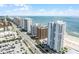 Stunning aerial perspective capturing the coastal skyline, community pool, and urban surroundings at 3023 S Atlantic Ave # 2050, Daytona Beach, FL 32118
