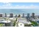 Expansive aerial shot displaying beachfront community with pools, parking, tennis courts, and ocean vistas at 3023 S Atlantic Ave # 2050, Daytona Beach, FL 32118
