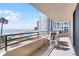 Spacious balcony with ocean view and seating, overlooking the pool and beach at 3023 S Atlantic Ave # 2050, Daytona Beach, FL 32118
