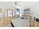 Serene bedroom with white furniture, tile floors, ocean view, and a comfortable bed setting at 3023 S Atlantic Ave # 2050, Daytona Beach, FL 32118