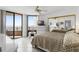 Bright bedroom with tile floors, a mirrored closet, and access to a private balcony with ocean views at 3023 S Atlantic Ave # 2050, Daytona Beach, FL 32118