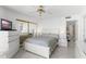 Cozy bedroom featuring tile flooring, a mirrored closet, and neutral decor for a calming ambiance at 3023 S Atlantic Ave # 2050, Daytona Beach, FL 32118