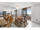 Dining room featuring seating for four, tile floors, a chandelier and access to the balcony at 3023 S Atlantic Ave # 2050, Daytona Beach, FL 32118