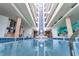 Bright indoor pool area with architectural details and natural light at 3023 S Atlantic Ave # 2050, Daytona Beach, FL 32118