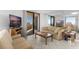 Bright living room with tile floors, neutral furniture, and a sliding glass door to the balcony at 3023 S Atlantic Ave # 2050, Daytona Beach, FL 32118