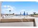 Outdoor pool deck with lounge chairs, tables, and umbrellas overlooking the ocean at 3023 S Atlantic Ave # 2050, Daytona Beach, FL 32118