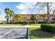 Attractive townhome with colorful exterior, red tile roof, and lush greenery at 3065 Yellow Lantana Ln, Kissimmee, FL 34747