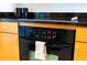 Built-in oven with modern appliances and wooden cabinets at 3065 Yellow Lantana Ln, Kissimmee, FL 34747