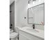 Modern bathroom featuring a sleek vanity with quartz countertop, black fixtures, and a tiled shower at 3159 Sw 127Th Lane Rd, Ocala, FL 34473