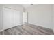 Empty bedroom with wood-look flooring and double-door closet at 3159 Sw 127Th Lane Rd, Ocala, FL 34473