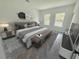 Cozy bedroom featuring a comfortable bed, stylish decor, and lots of natural light at 3159 Sw 127Th Lane Rd, Ocala, FL 34473