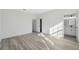 Spacious bedroom with modern flooring, neutral paint, and an en-suite bathroom at 3159 Sw 127Th Lane Rd, Ocala, FL 34473