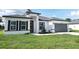 Charming single-story home features a two-car garage, crisp white stucco, and black accents at 3159 Sw 127Th Lane Rd, Ocala, FL 34473