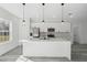 Bright kitchen with center island features quartz counters and stainless steel appliances at 3159 Sw 127Th Lane Rd, Ocala, FL 34473
