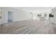 An expansive living room showcases neutral walls and flooring, complemented by an open floor plan at 3159 Sw 127Th Lane Rd, Ocala, FL 34473