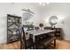 Cozy dining area featuring modern table, chairs and lighting with adjacent living room at 3404 Village Green Ct, St Cloud, FL 34772