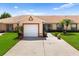 Charming single-story home with a well-maintained lawn and two-car garage in a peaceful neighborhood at 3404 Village Green Ct, St Cloud, FL 34772