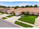 Charming single-story home featuring an attached garage, lush lawn, and well-maintained landscaping, creating curb appeal at 3404 Village Green Ct, St Cloud, FL 34772