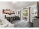 Inviting living room featuring comfortable seating, decorative artwork, and a sliding door to the outdoor patio at 3404 Village Green Ct, St Cloud, FL 34772