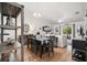 Open concept living area with dining table and living room featuring modern decor at 3404 Village Green Ct, St Cloud, FL 34772