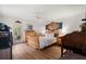 Inviting main bedroom with wood floors, ceiling fan, and private access to the outdoors at 3404 Village Green Ct, St Cloud, FL 34772