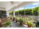 Relaxing sunroom filled with lush plants, providing a serene indoor-outdoor living experience at 3404 Village Green Ct, St Cloud, FL 34772