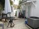 Back patio area features a cozy outdoor seating area and access to the home at 362 White Marsh Cir, Orlando, FL 32824