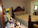 Bedroom view features a dark wood bed frame and a light green striped bed spread at 362 White Marsh Cir, Orlando, FL 32824