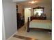 Bedroom features dark wood furnishings and light tile flooring at 362 White Marsh Cir, Orlando, FL 32824