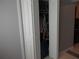 Image features an open closet door with various clothing items inside at 362 White Marsh Cir, Orlando, FL 32824