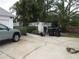 Wide driveway in front of a charming one-story home with lush tropical landscaping at 362 White Marsh Cir, Orlando, FL 32824