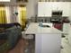 Modern kitchen with island seating, stainless steel appliances, and tile backsplash at 362 White Marsh Cir, Orlando, FL 32824