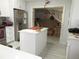 Modern kitchen with island, stainless steel appliances and tile backsplash at 362 White Marsh Cir, Orlando, FL 32824