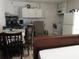 This kitchen and dining area includes white cabinets, a range, and a refrigerator at 362 White Marsh Cir, Orlando, FL 32824