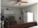 Well-lit kitchen featuring white cabinets, a range, and a refrigerator at 362 White Marsh Cir, Orlando, FL 32824