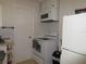 Functional kitchen featuring white cabinets, range, and refrigerator at 362 White Marsh Cir, Orlando, FL 32824
