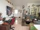 Spacious living room featuring tile floors, tv, and glass display cabinet at 362 White Marsh Cir, Orlando, FL 32824