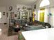 Comfortable living room with tile floors, display cabinet, and bright natural light at 362 White Marsh Cir, Orlando, FL 32824