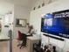 Office area with a large television and bright natural light at 362 White Marsh Cir, Orlando, FL 32824