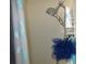 Shower features a shower head and shower caddy holding shower essentials at 362 White Marsh Cir, Orlando, FL 32824