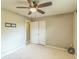 Bedroom featuring a ceiling fan, closet, neutral paint, and carpeting at 403 Broadview Ave, Altamonte Springs, FL 32701