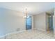 Dining room features tile floors and a chandelier at 403 Broadview Ave, Altamonte Springs, FL 32701