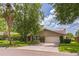 Charming single-story home with a well-manicured lawn, mature trees, and an attached garage at 403 Broadview Ave, Altamonte Springs, FL 32701