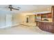 An open-concept kitchen featuring stainless steel appliances and wood cabinets at 403 Broadview Ave, Altamonte Springs, FL 32701