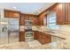 A modern kitchen with stainless steel appliances and granite countertops at 403 Broadview Ave, Altamonte Springs, FL 32701